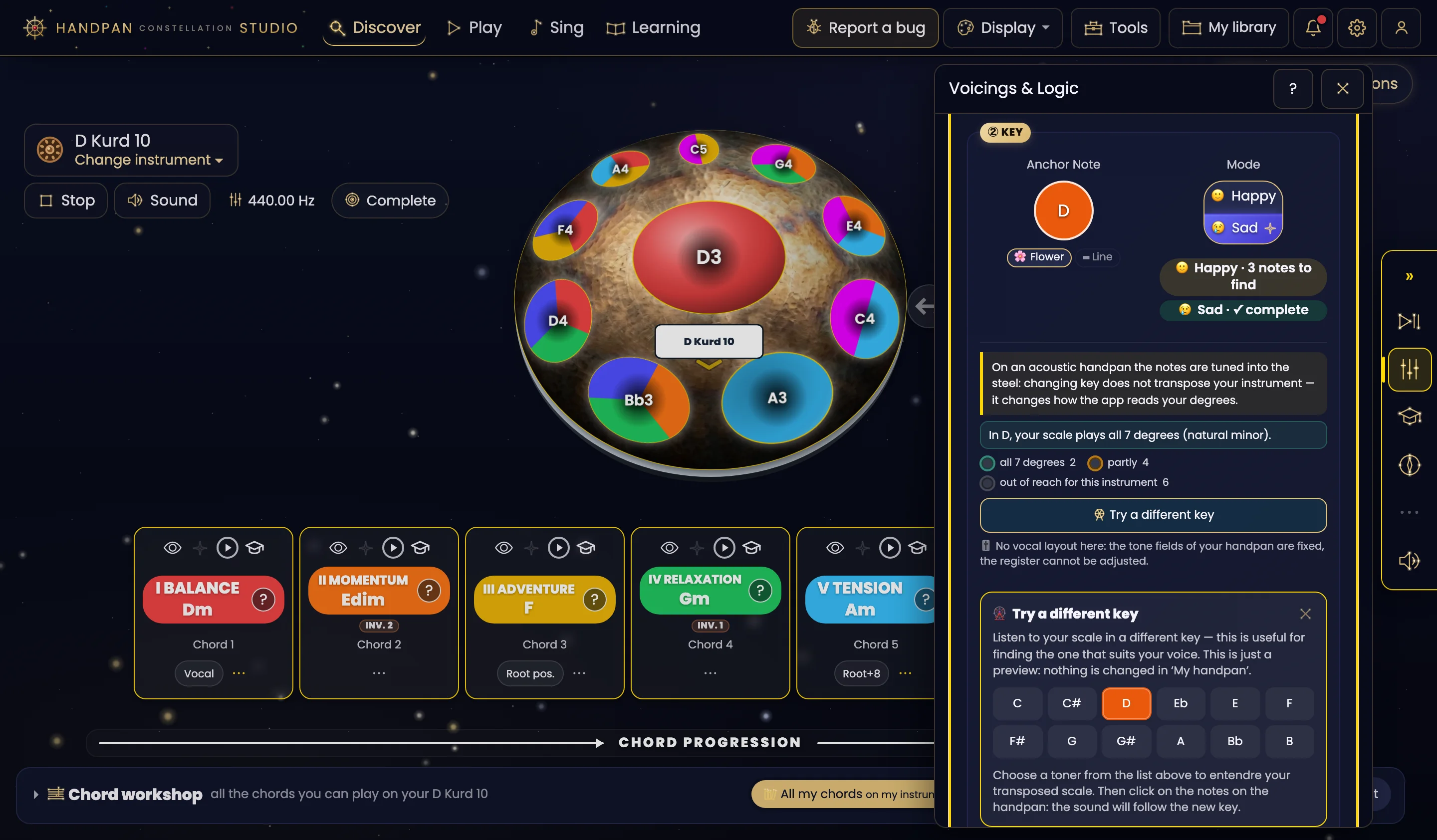 Acoustic mode with a D Kurd 10 loaded, Starry Night theme. On the left, the pan: the notes are coloured as pie slices — one slice per chord the note belongs to — and the handpan's screen, under the D3 ding, reads “D Kurd 10”. At the bottom, the degree cards I to V. On the right, the “Voicings & Logic” drawer, Key section: anchor note D, Sad mode, the reminder that on an acoustic handpan the notes are tuned into the steel, then the “Try a different key” button. Below it, the open “Try a different key” panel explains: “Listen to your scale in a different key — this is useful for finding the one that suits your voice. This is just a preview: nothing is changed in ‘My handpan’”, followed by the twelve keys C to B; the D key is lit orange.