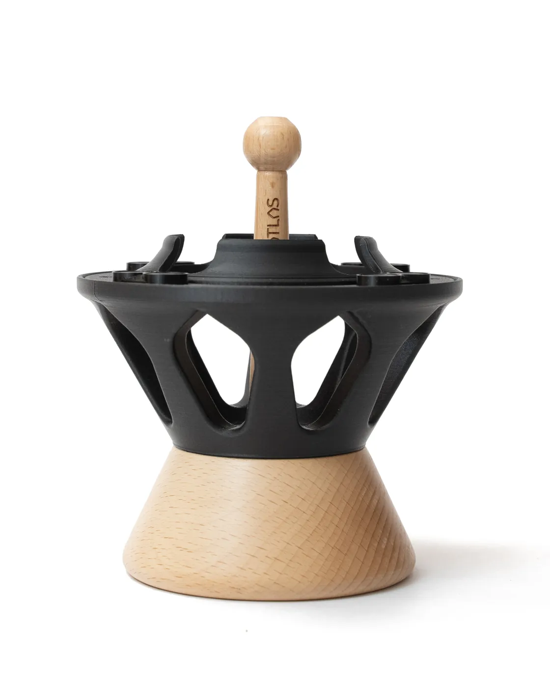 The main body of the Atlas All: the black openwork crown and its wooden rod, resting on the turned wooden base.