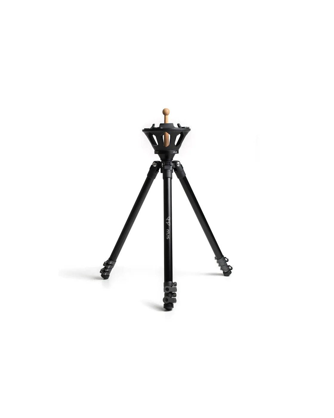The Atlas Pro tripod unfolded against a white background: a black openwork aluminium crown with a light wooden centring rod through it, and three splayed legs.