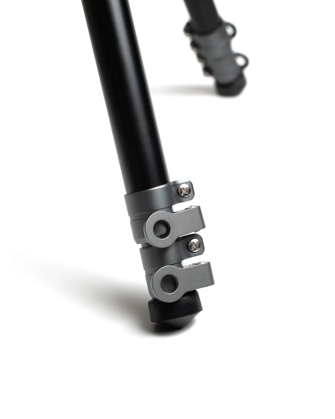 Close-up of the locking system on one of the Atlas Pro’s telescopic legs: the metal quick-clamp collar.